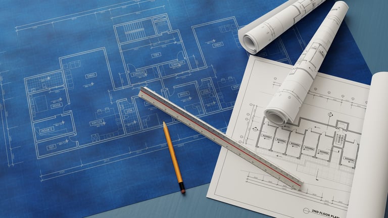 Architectural blueprints and floor plans being designed