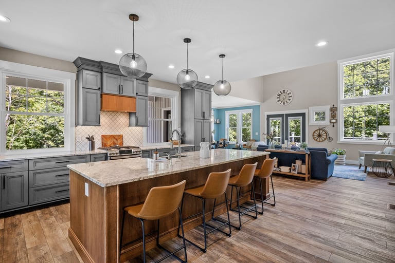 Beautiful modern kitchen with large island and wood flooring