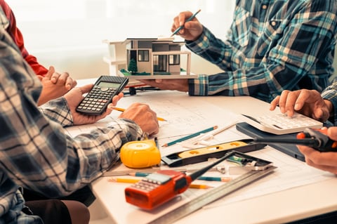 Contractor and homeowner reviewing plans together