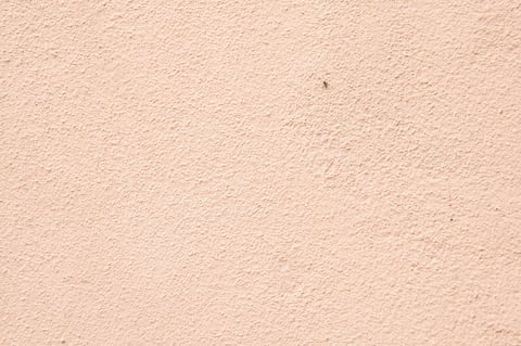 This is an upclose view depicting the intricate texture of a wall that has a soothing beige color to it