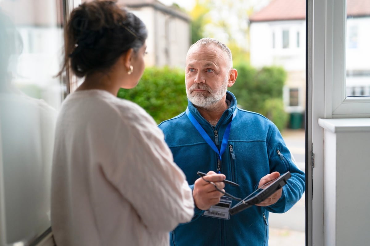 Southwest Florida remodeling consultant meeting with a homeowner at their front door for an on-site project consultation
