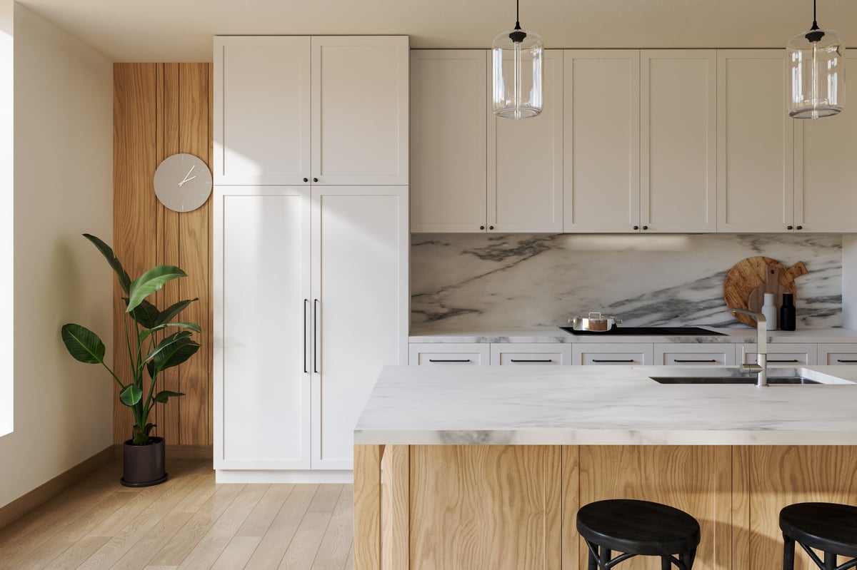 Modern kitchen with white cabinets and marble island in a Sarasota home