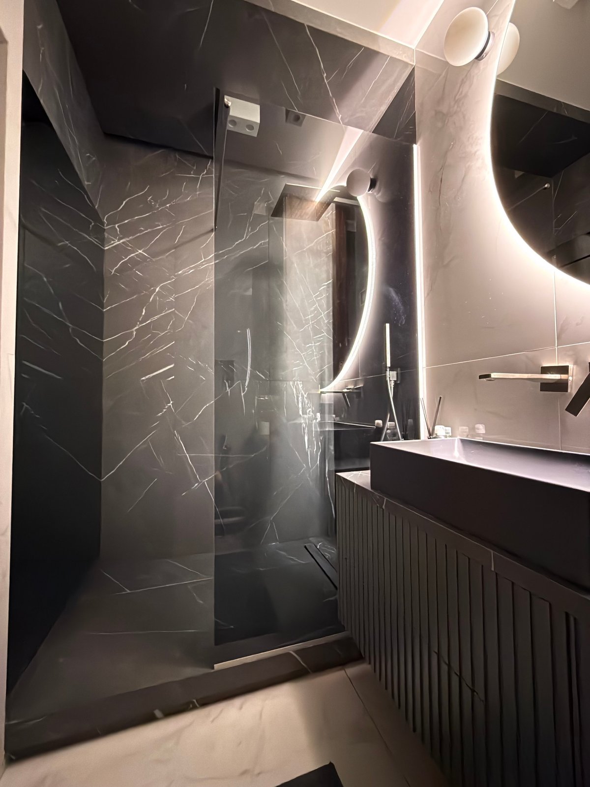 Luxury modern bathroom with marble shower and vanity in a Sarasota home